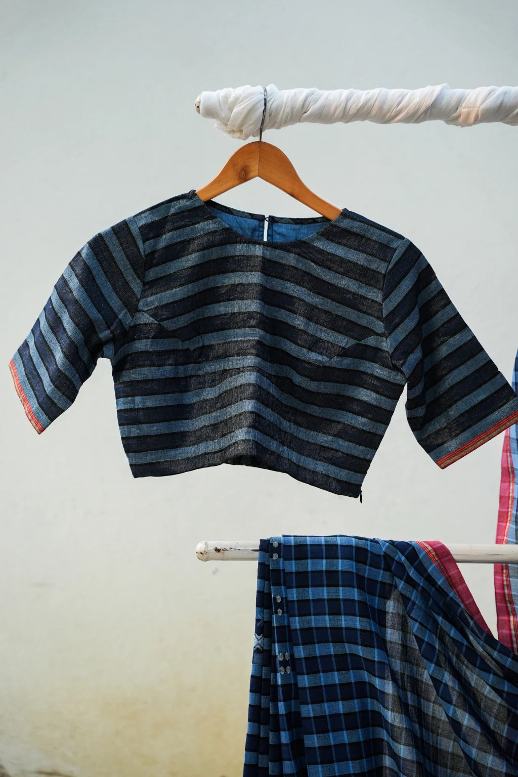 Sarron Nila-001 Saree, indigo checked cotton Jamdani saree with abstract geometric motifs and red selvedge.