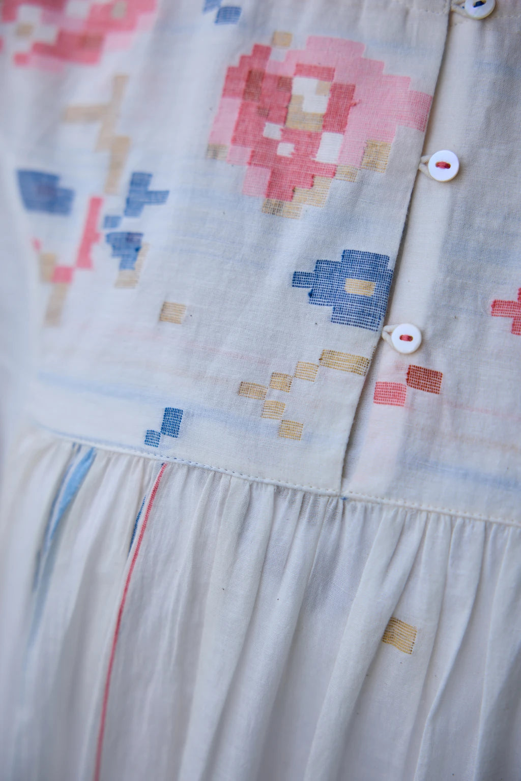 Soma Dress — White handloom cotton Jamdani dress with floral yoke — fabric detail | Sarron